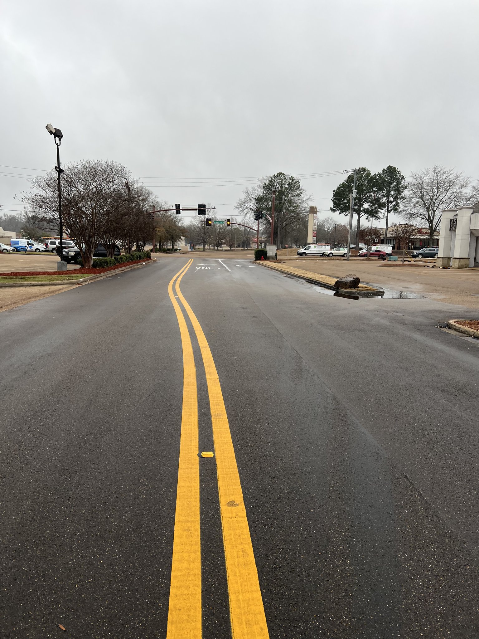 Yellow double center line road striping on fresh asphalt in Ridgeland Ridgeland by AF&G LLC