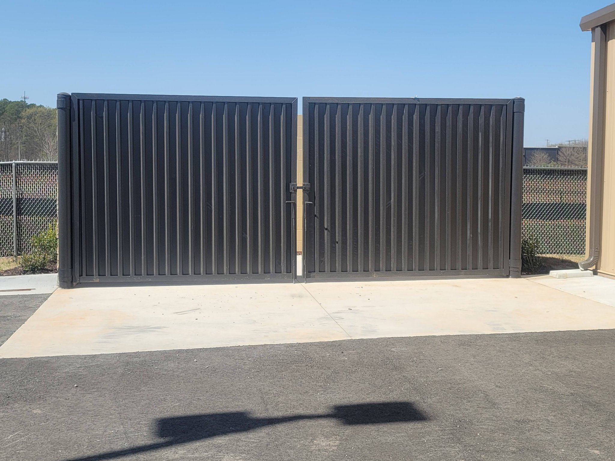 Dumpster enclosure gate at Caliber Collision Maumelle AR