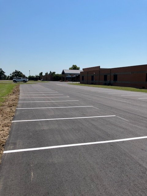 Parking lot striping on new asphalt - Dumas AR